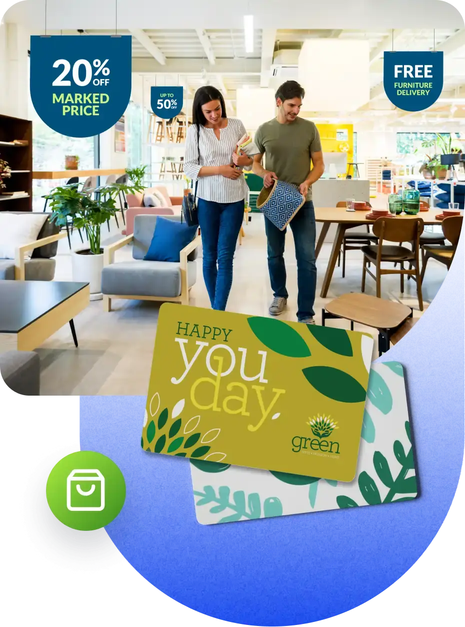 A furniture store with a couple walking through it. The store has modern furniture and decor, with signs indicating '20% off marked price' and 'Free furniture delivery'. Below the store image is a gift card with the text 'Happy you day' and the logo of 'green' featuring green leaves on a yellow and green background.